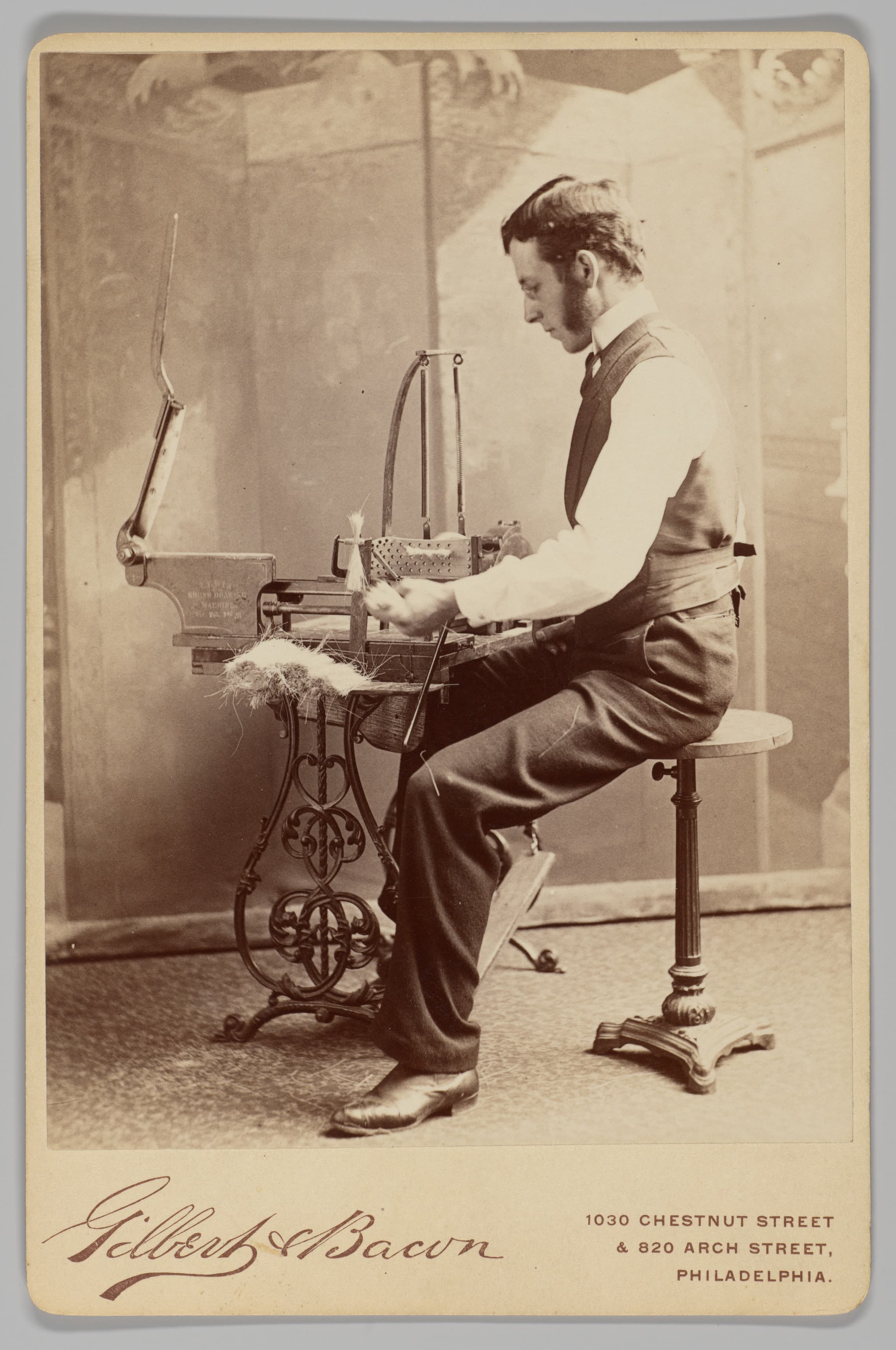 [Man Operating Brush Drawing Machine] by Gilbert & Bacon, 1880s.
